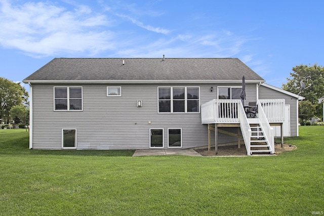 back of property featuring a deck and a yard