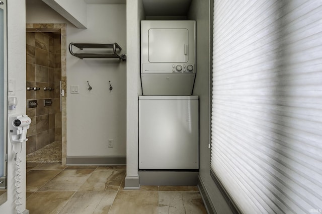 laundry area with stacked washer and dryer