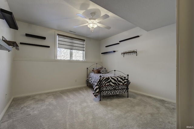 bedroom featuring ceiling fan and light colored carpet