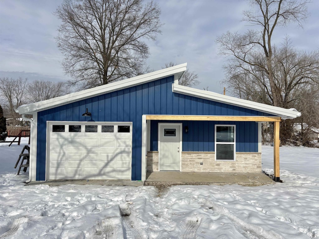 view of snow covered garage