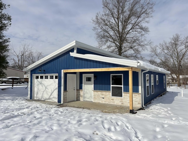 view of snow covered garage