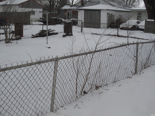 view of yard layered in snow