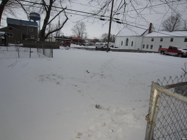 view of yard layered in snow