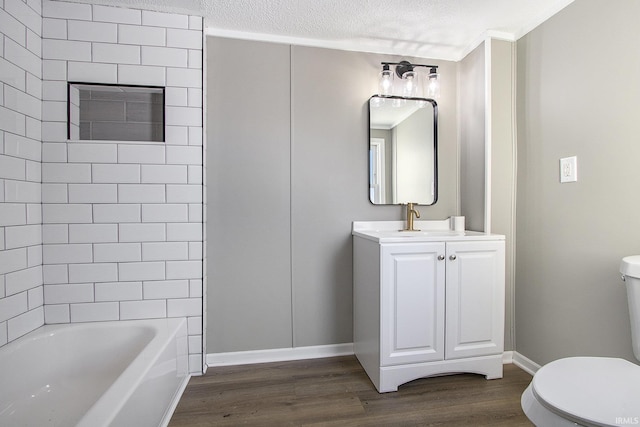 full bathroom with vanity, a textured ceiling, shower / tub combination, hardwood / wood-style flooring, and toilet