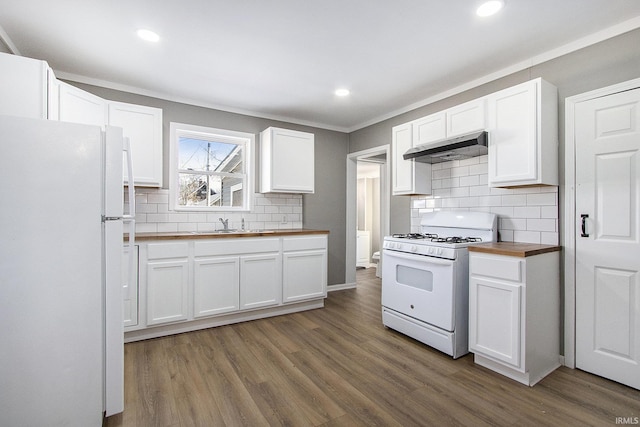 kitchen featuring butcher block counters, white cabinetry, dark hardwood / wood-style floors, crown molding, and white appliances