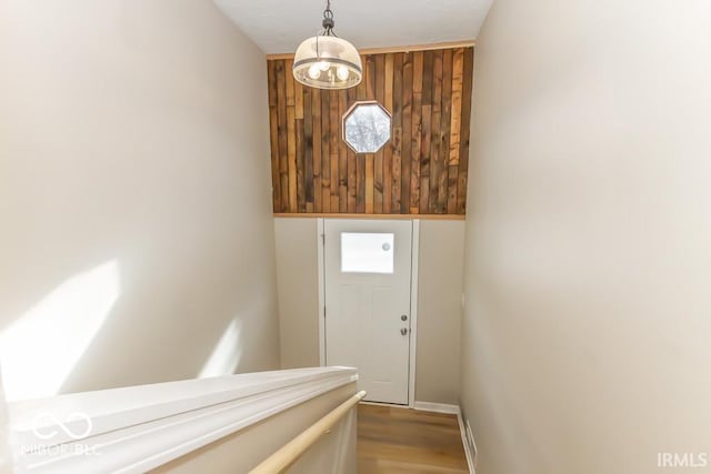 staircase with hardwood / wood-style flooring