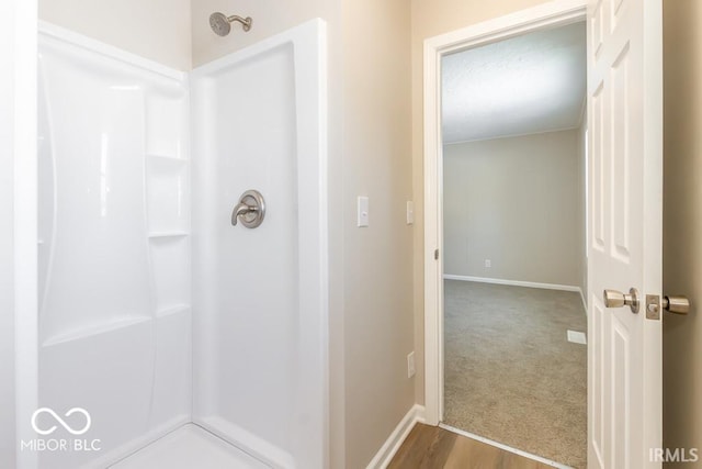 bathroom featuring walk in shower