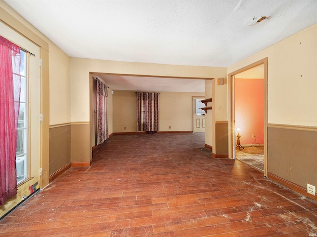 unfurnished room featuring hardwood / wood-style flooring