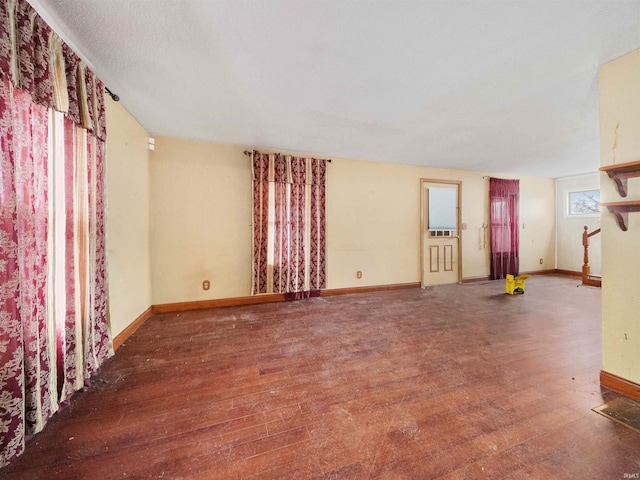 unfurnished living room featuring wood-type flooring