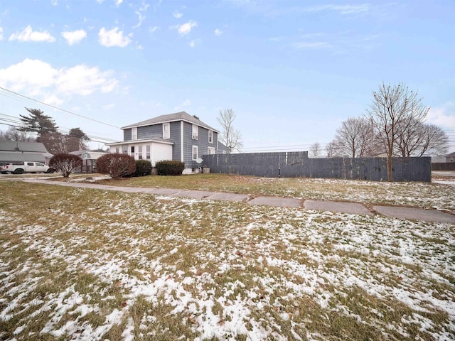 view of yard covered in snow