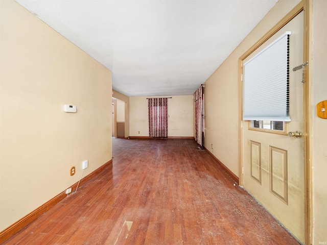 unfurnished room featuring hardwood / wood-style flooring