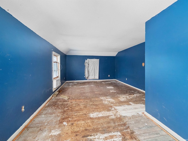 empty room with vaulted ceiling