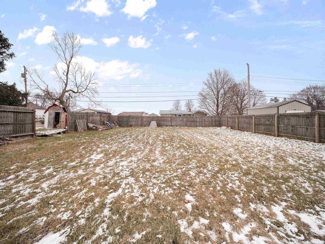 view of yard layered in snow