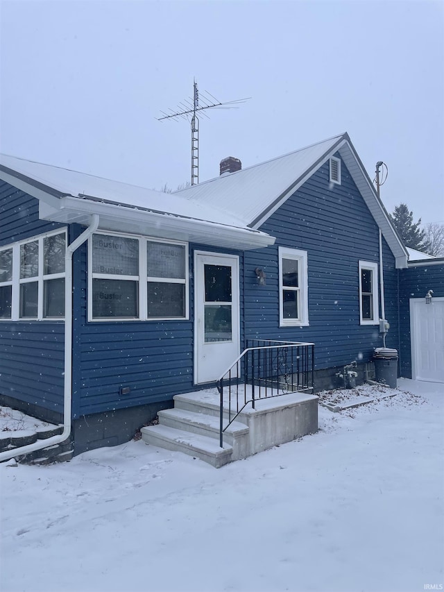 view of snow covered house