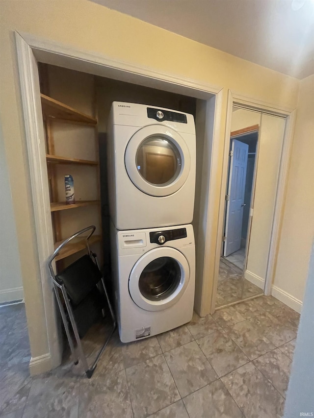 laundry room featuring stacked washer and dryer