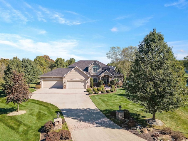 view of front of house featuring a garage and a front yard