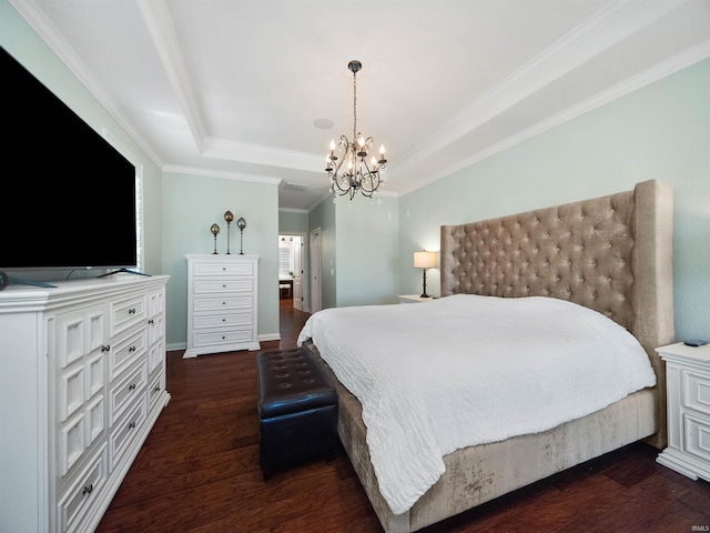 bedroom with a tray ceiling, crown molding, dark hardwood / wood-style floors, and an inviting chandelier