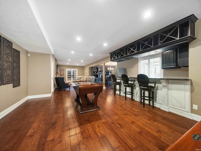 playroom with dark hardwood / wood-style floors and billiards