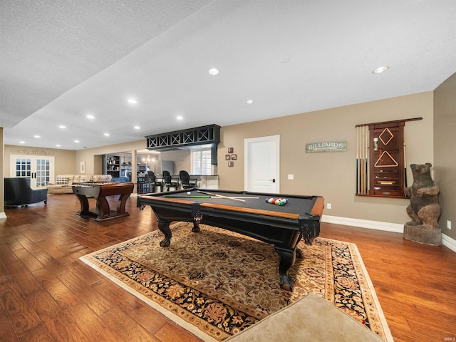 rec room featuring wood-type flooring, a textured ceiling, and billiards