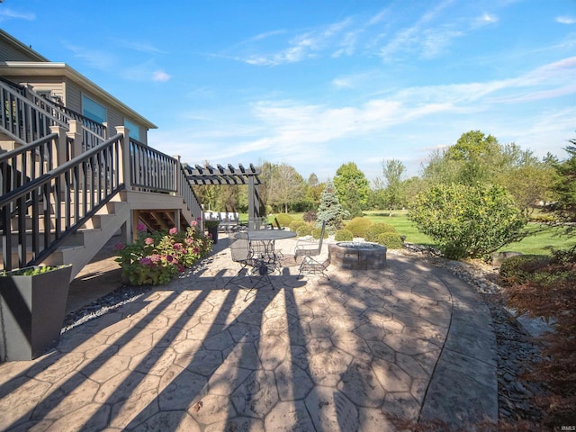 view of patio / terrace featuring a pergola and an outdoor fire pit