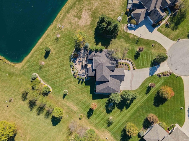 birds eye view of property with a water view