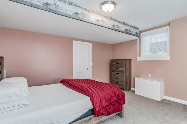 carpeted bedroom with a textured ceiling