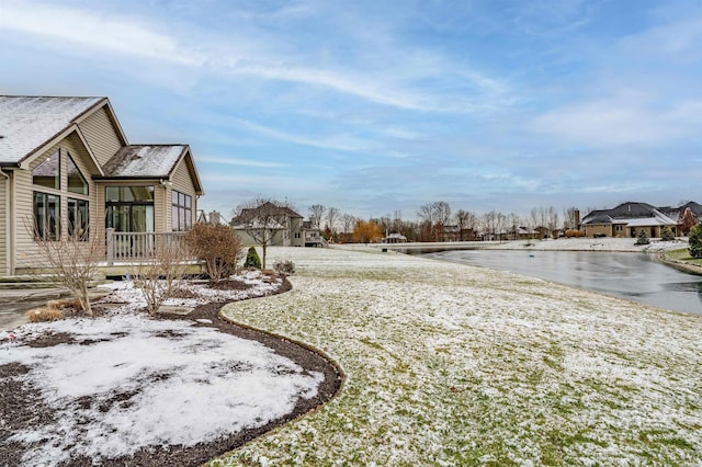 view of yard layered in snow