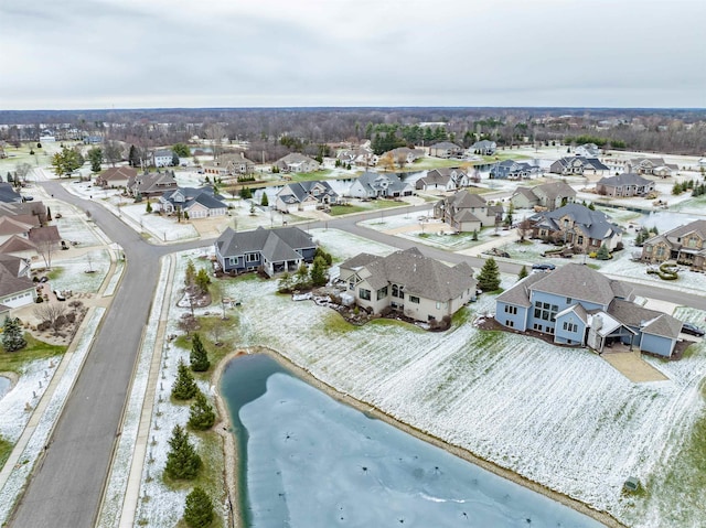 birds eye view of property with a water view and a view of the beach