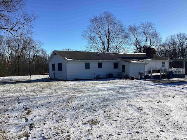 view of snow covered house