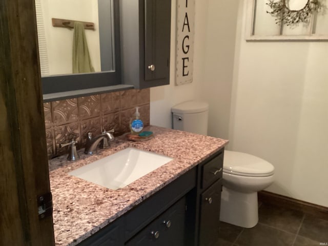 bathroom with backsplash, tile patterned flooring, vanity, and toilet