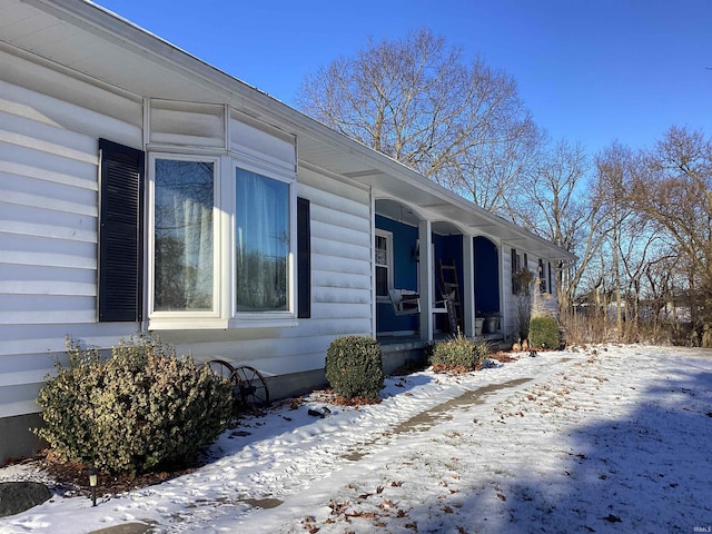 view of snow covered property