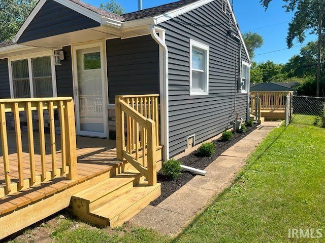 exterior space with a lawn and a deck