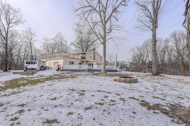 exterior space featuring a fire pit and covered porch