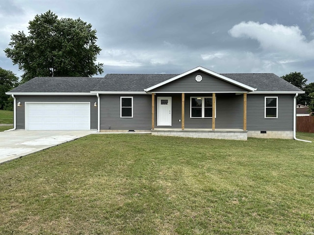 view of front of property with covered porch, a garage, and a front yard