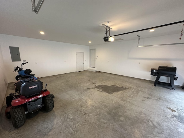 garage featuring electric panel and a garage door opener