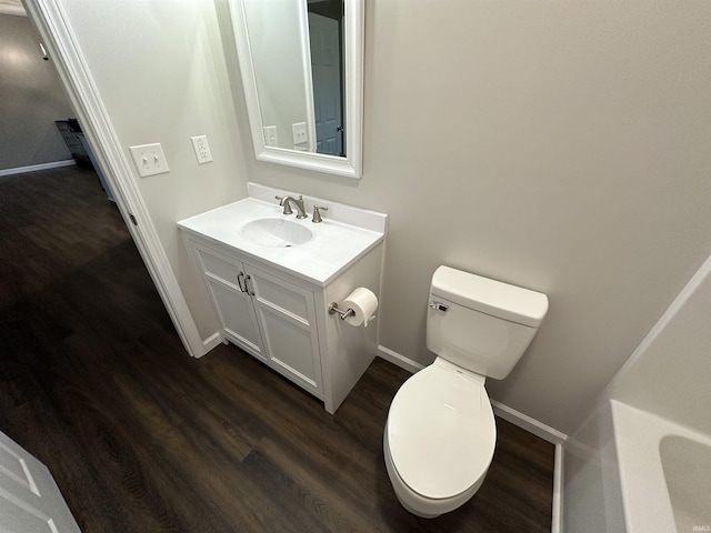 bathroom featuring hardwood / wood-style floors, vanity, and toilet