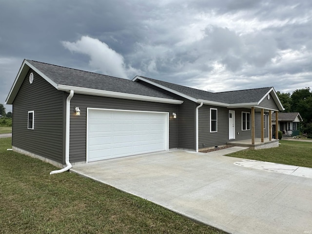 ranch-style house with a front lawn, covered porch, and a garage