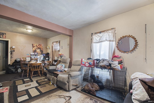 living room with beamed ceiling