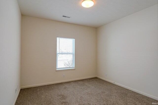 unfurnished room with carpet flooring