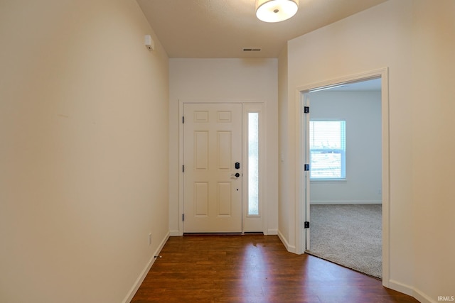 entrance foyer featuring dark hardwood / wood-style floors