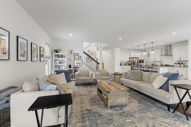 living area with stairs and recessed lighting