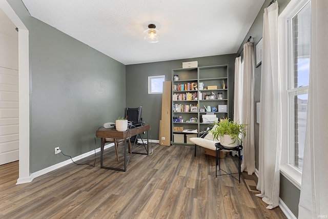 office featuring dark hardwood / wood-style floors and a textured ceiling