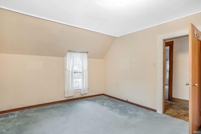 bonus room with carpet and lofted ceiling