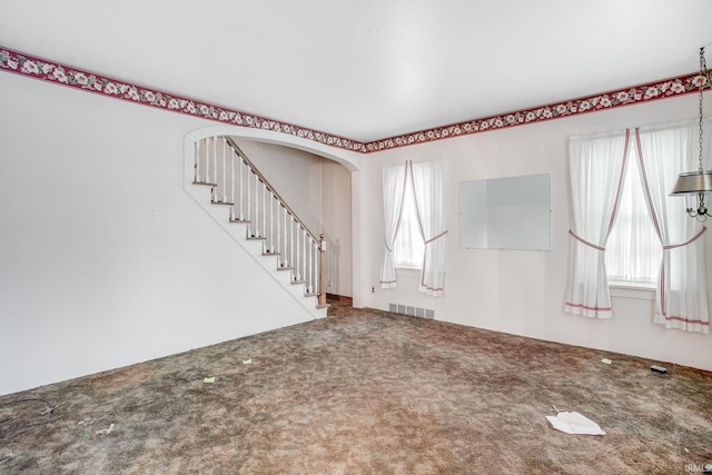 foyer entrance featuring plenty of natural light and carpet floors