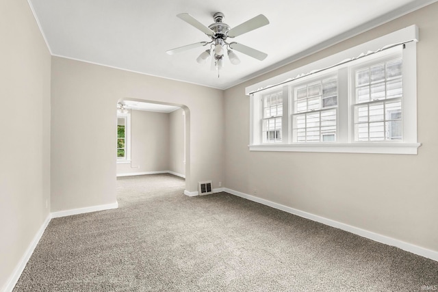 spare room with carpet and ceiling fan