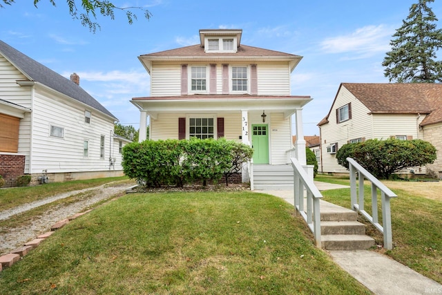 bungalow-style house with a front lawn