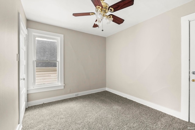 empty room with carpet flooring and ceiling fan