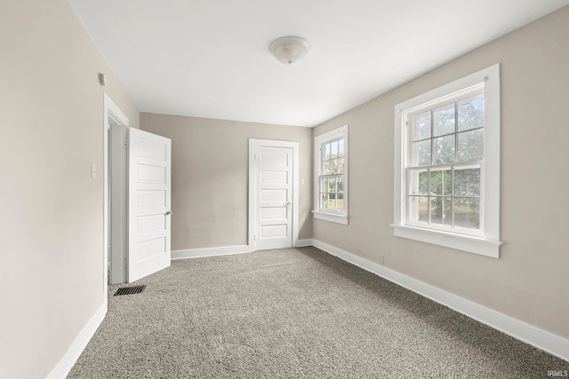 unfurnished bedroom with carpet floors