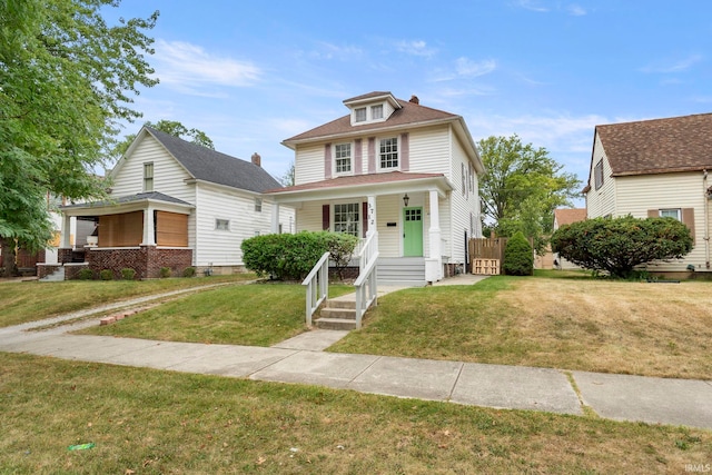 view of front facade with a porch and a front yard