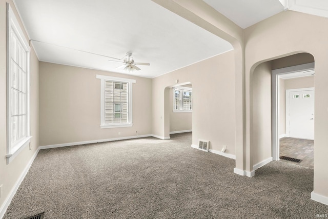 carpeted empty room featuring ceiling fan